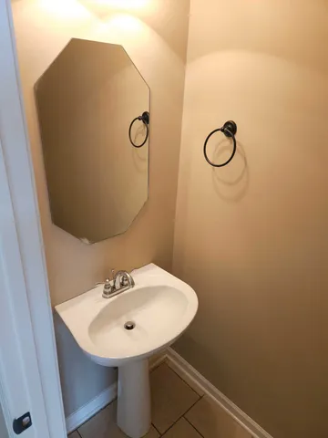 a bathroom with a sink a mirror and a shower