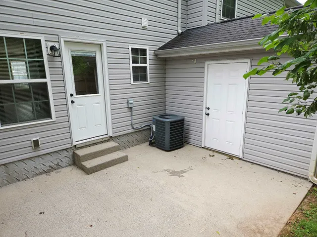 a view of a porch with wooden fence