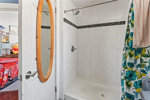a bathroom with a toilet a sink and a mirror