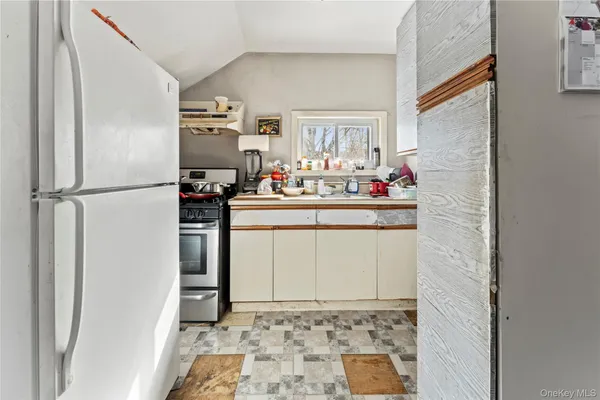 a bedroom with furniture and a wooden floor