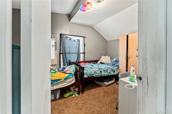 a bedroom with furniture and a window