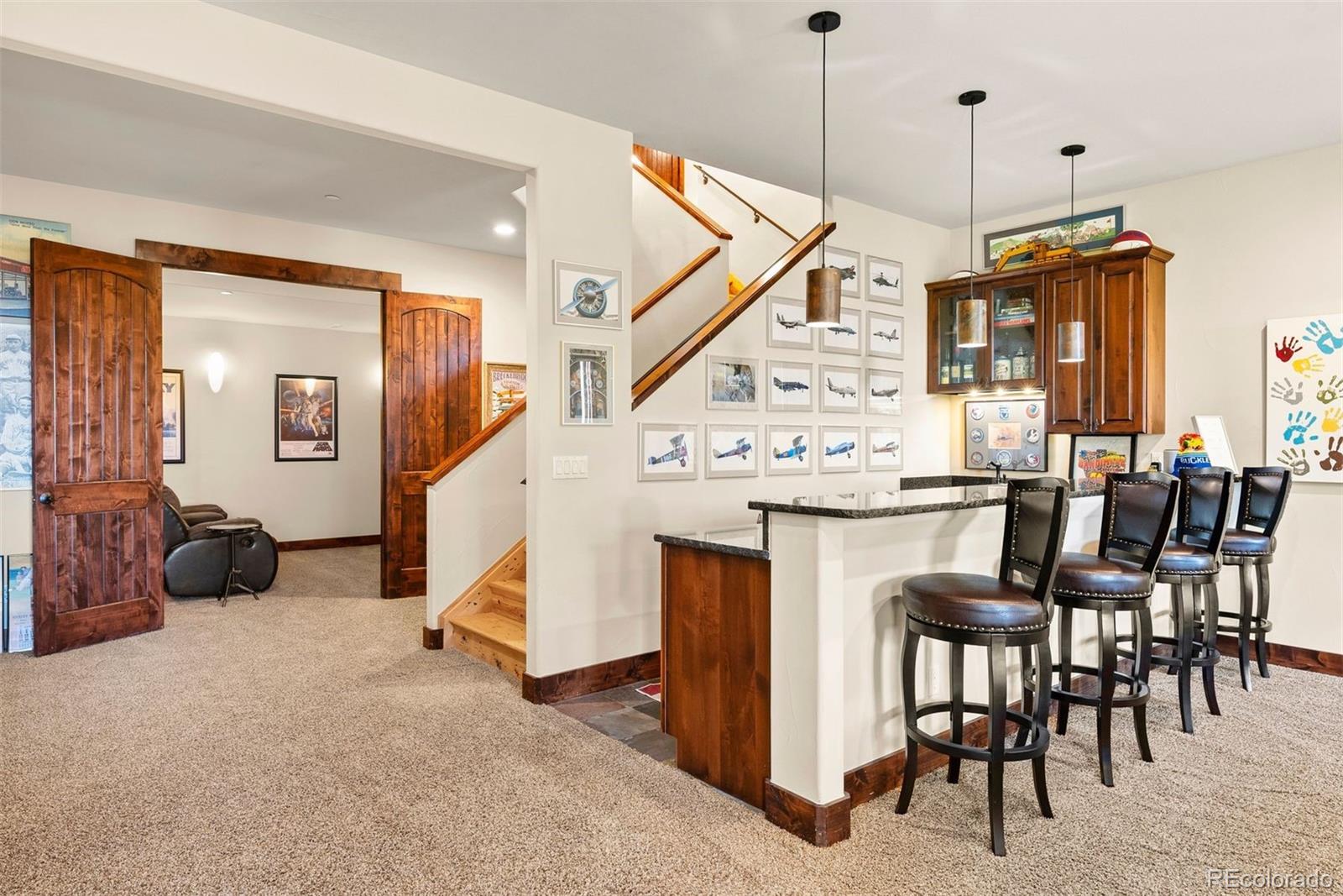 610 Clear Creek Road Evergreen, CO 80439 - Photo 31 of 50 a kitchen with a table chairs and entryway