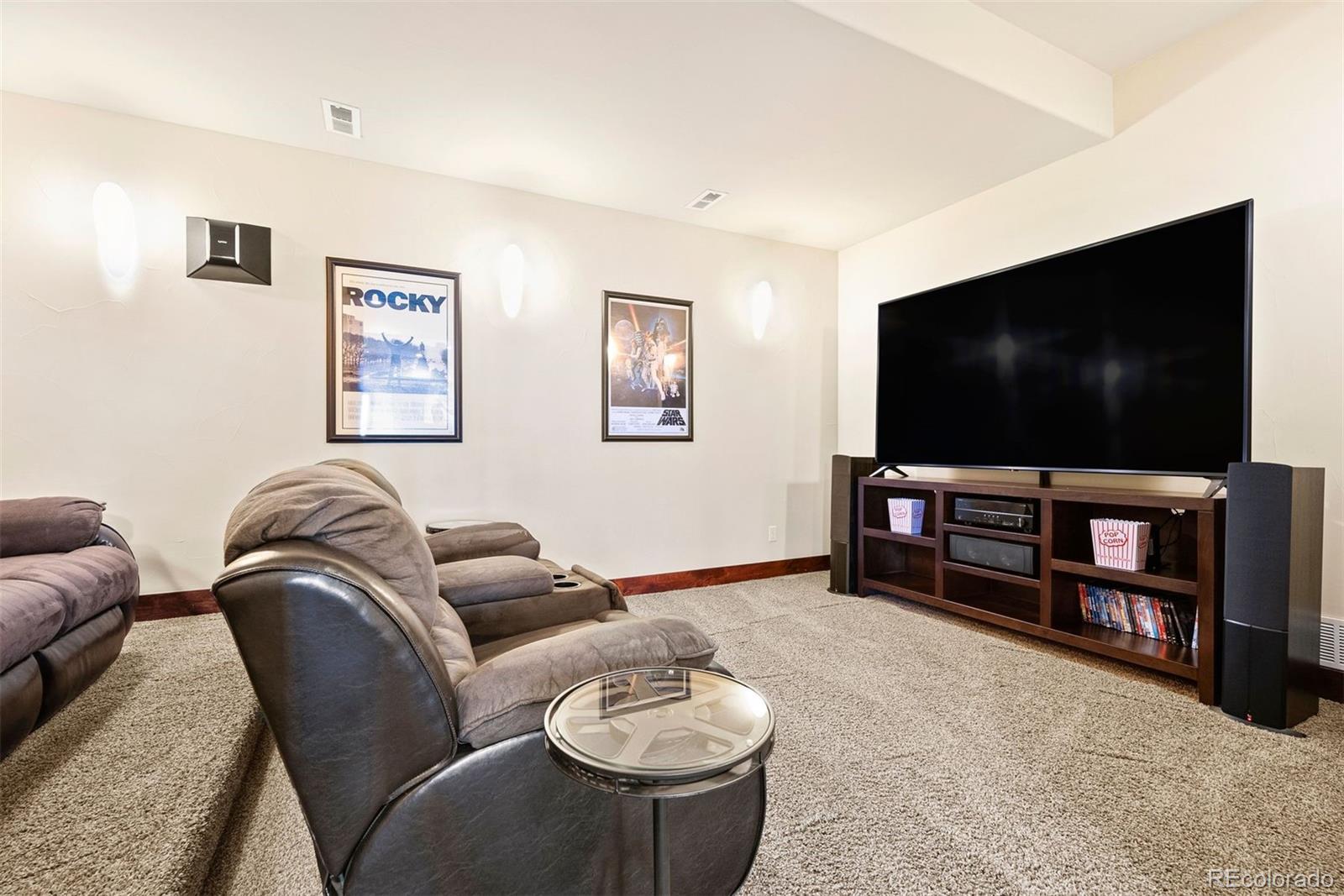 610 Clear Creek Road Evergreen, CO 80439 - Photo 32 of 50 a living room with furniture and a flat screen tv