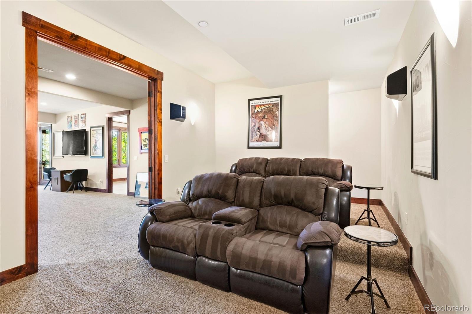 610 Clear Creek Road Evergreen, CO 80439 - Photo 33 of 50 a living room with furniture and a wooden floor