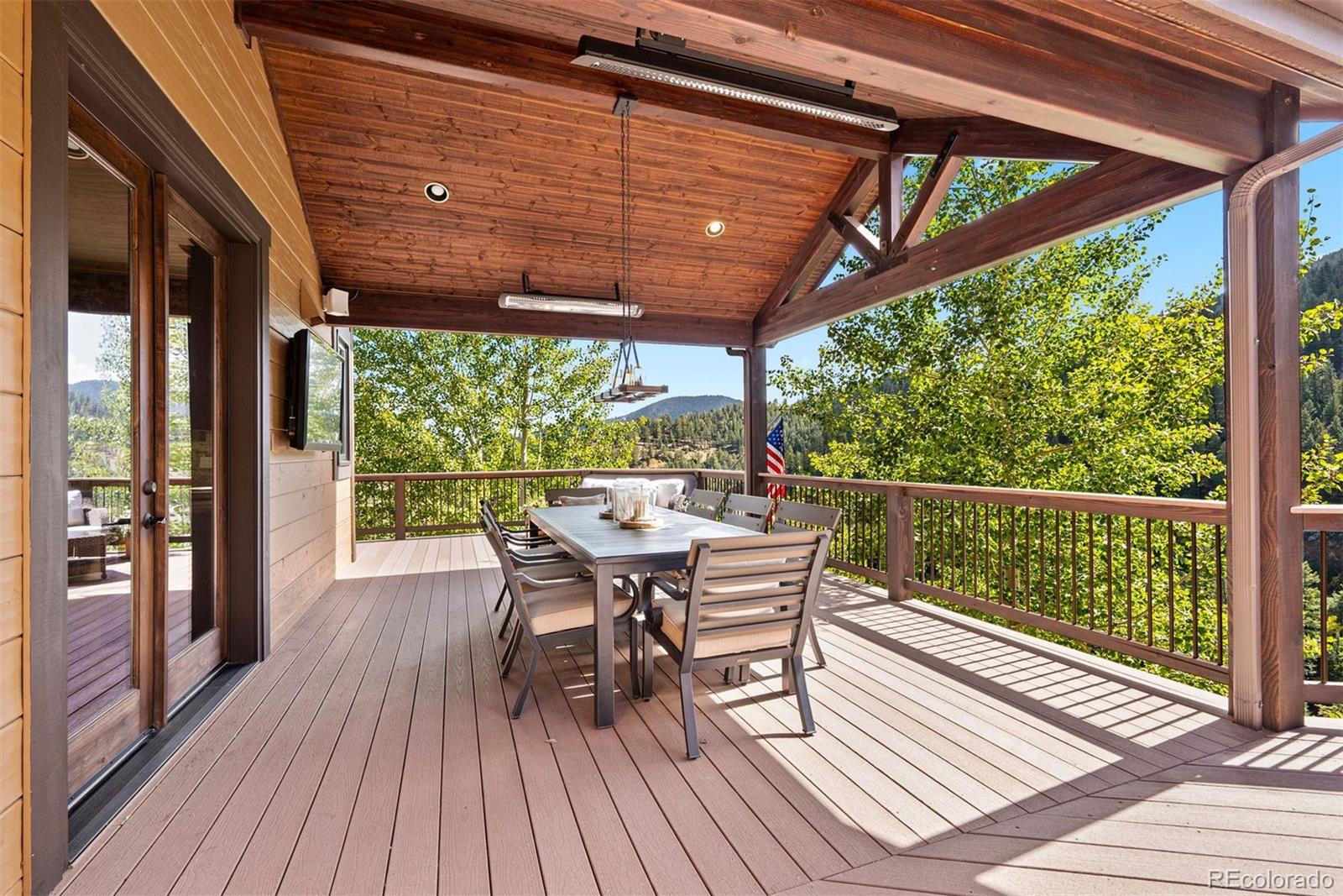 610 Clear Creek Road Evergreen, CO 80439 - Photo 40 of 50 a view of a two chairs in the deck