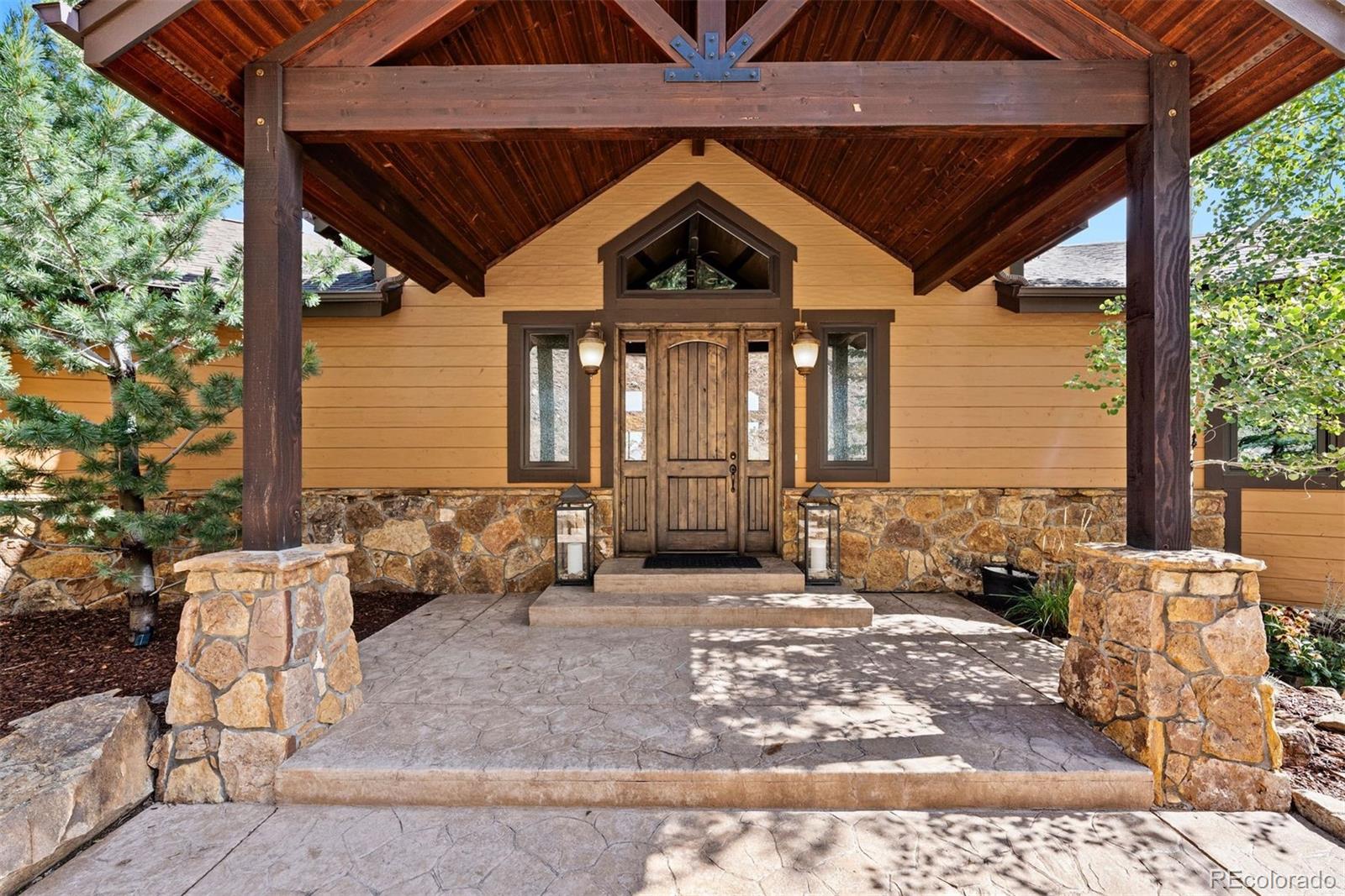 610 Clear Creek Road Evergreen, CO 80439 - Photo 4 of 50 a front view of a house with windows