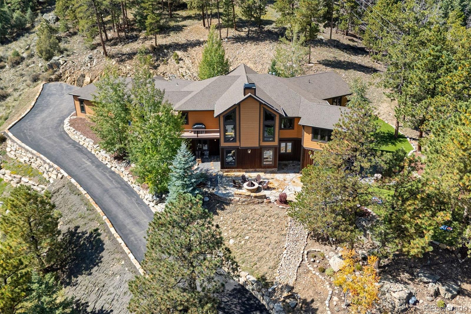 610 Clear Creek Road Evergreen, CO 80439 - Photo 46 of 50 an aerial view of a house with a yard basket ball court and outdoor seating