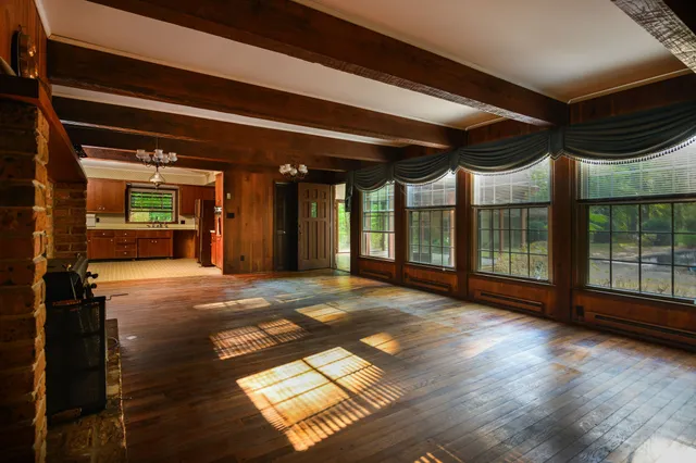a view of livingroom with hardwood floor and a ceiling fan