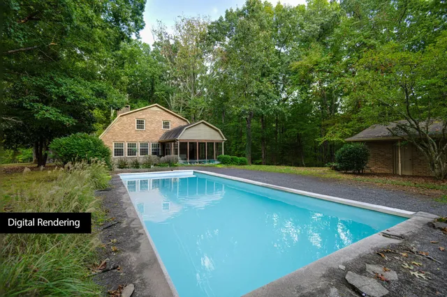 a kitchen with stainless steel appliances kitchen island granite countertop a refrigerator and wooden cabinets