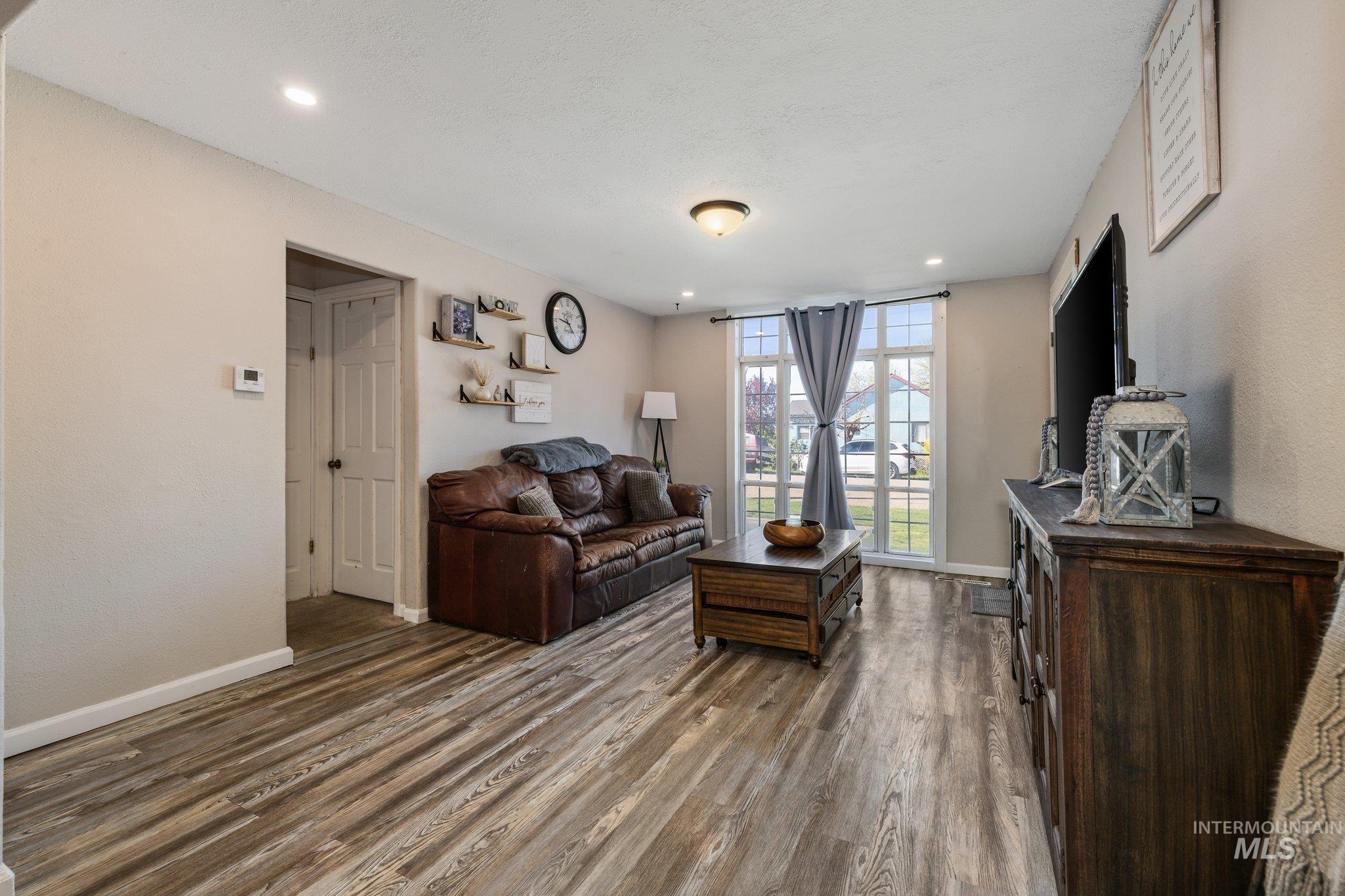 1504 2nd Street North Nampa, ID 83687 - Photo 6 of 29 Living area with dark wood-style flooring and recessed lighting