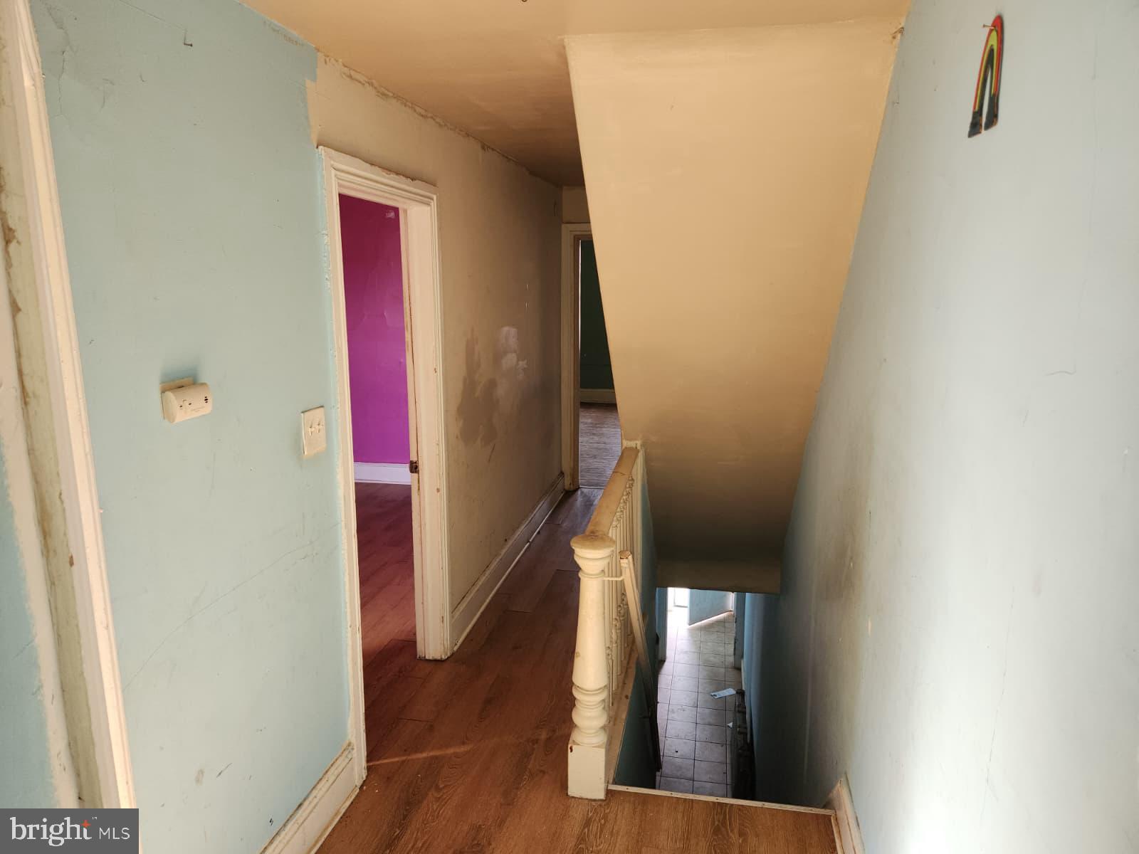 648 Kohn Street Norristown, PA 19401 - Photo 26 of 39 a view of a hallway with wooden floor and staircase