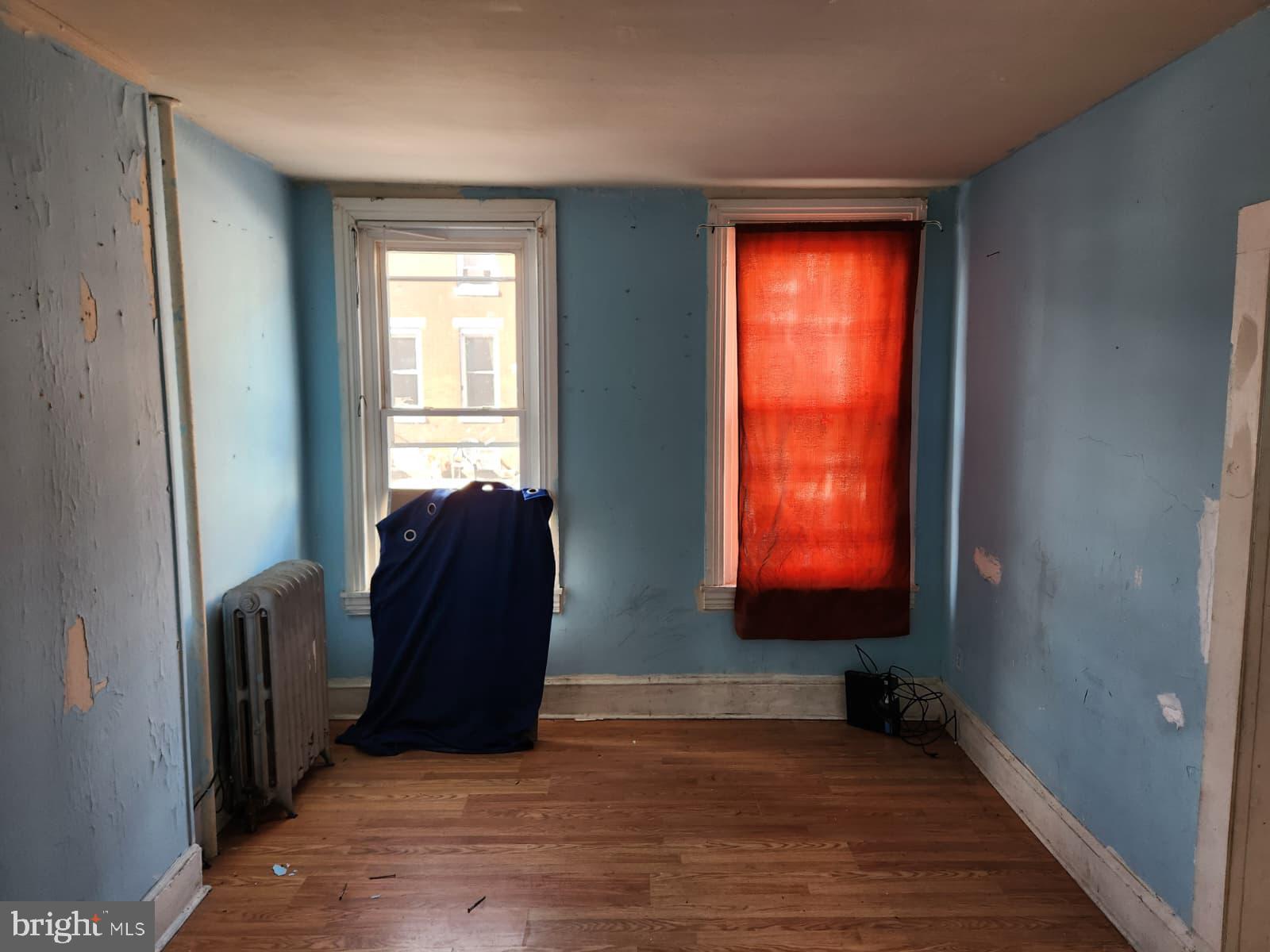 648 Kohn Street Norristown, PA 19401 - Photo 3 of 39 a view of a livingroom with wooden floor and windows
