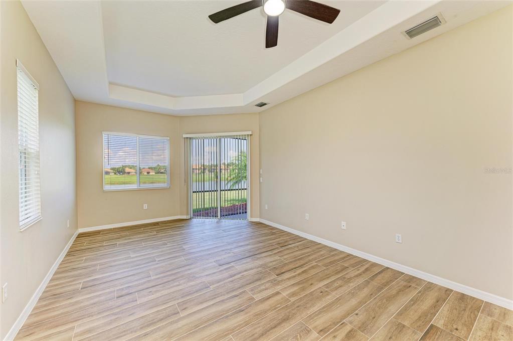 8772 Stone Harbour Loop Bradenton, FL 34212 - Photo 24 of 69 wooden floor in an empty room with a window