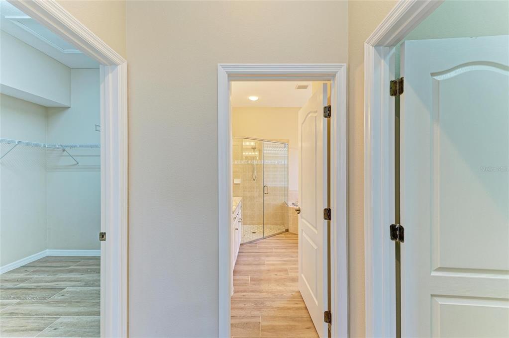 8772 Stone Harbour Loop Bradenton, FL 34212 - Photo 26 of 69 a view of a bathroom from a hallway