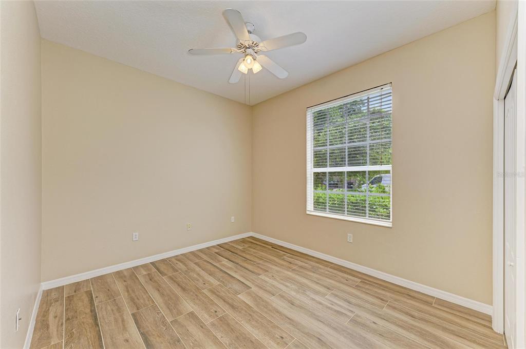 8772 Stone Harbour Loop Bradenton, FL 34212 - Photo 36 of 69 an empty room with a window and a ceiling fan