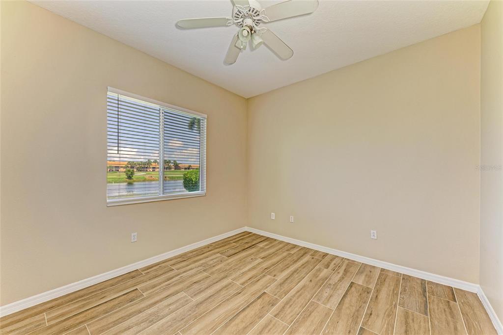 8772 Stone Harbour Loop Bradenton, FL 34212 - Photo 38 of 69 wooden floor in an empty room with a window