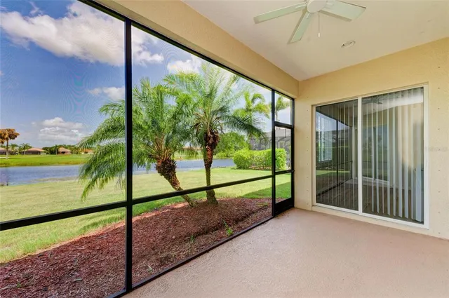 an aerial view of a house with a yard and a large pool