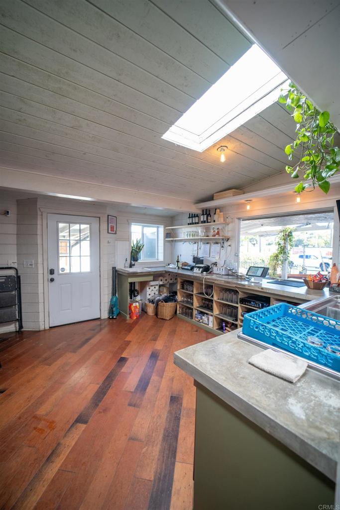 838 East Mission Road Fallbrook, CA 92028 - Photo 29 of 49 a room with lots of furniture and potted plants