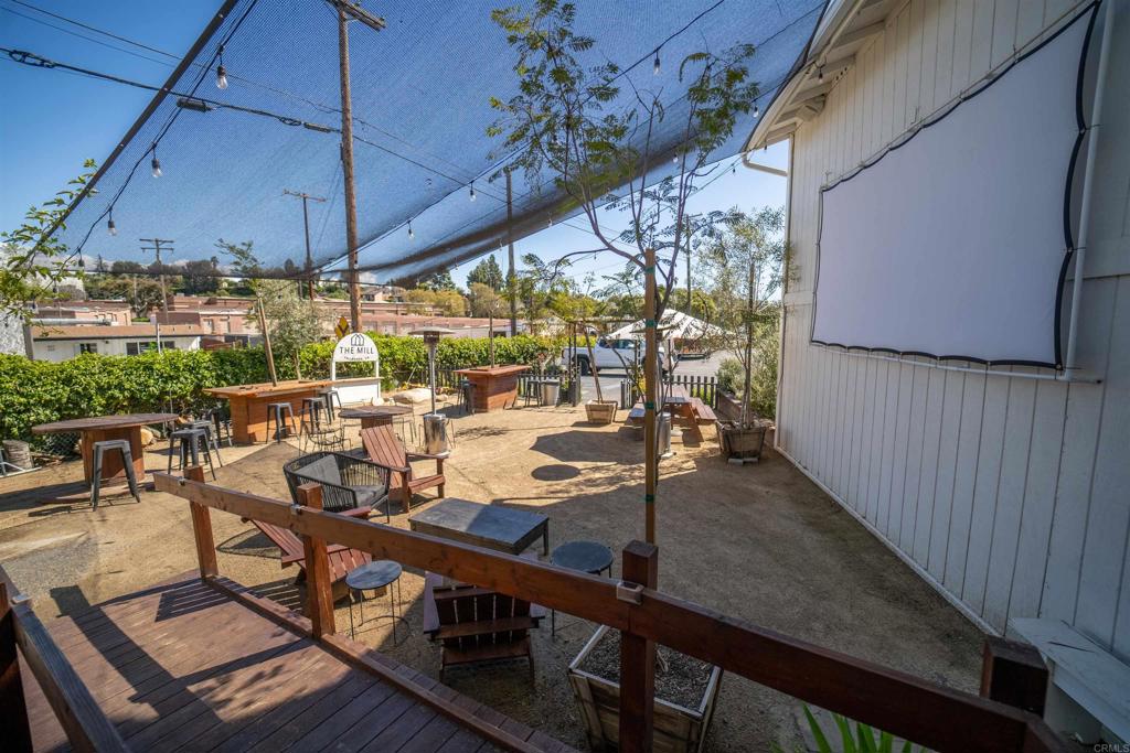 838 East Mission Road Fallbrook, CA 92028 - Photo 38 of 49 a view of a balcony with chairs and wooden floor