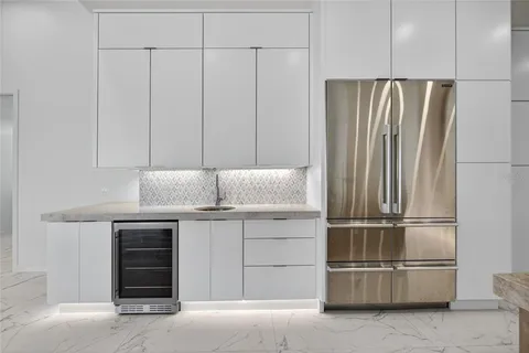 a kitchen with cabinets and stainless steel appliances