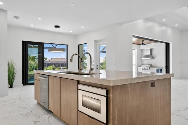 a kitchen with sink and window