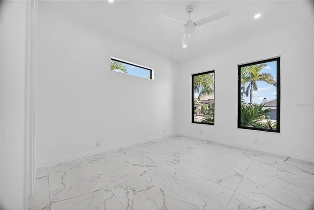 an empty room with windows and closet