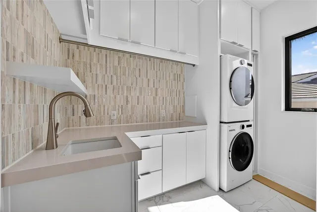 a bathroom with a sink and a washing machine