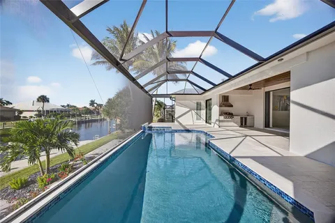 a view of a swimming pool with a patio