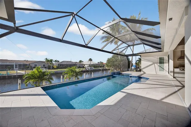 a view of swimming pool with outdoor seating