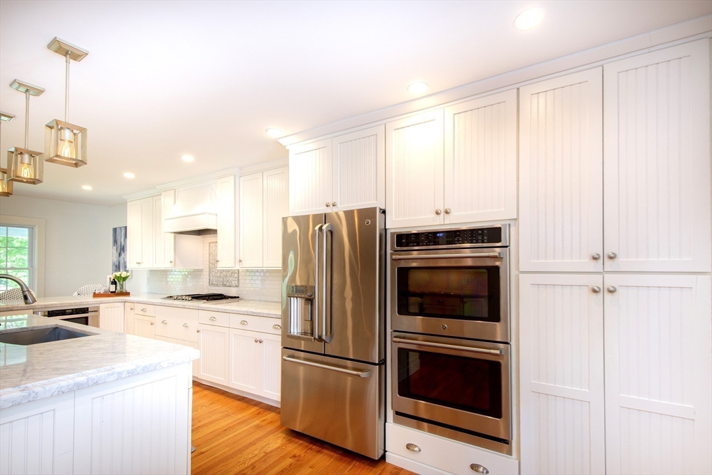 584 Hatherly Road Scituate, MA 02066 - Photo 15 of 42 a kitchen with a refrigerator stove and sink