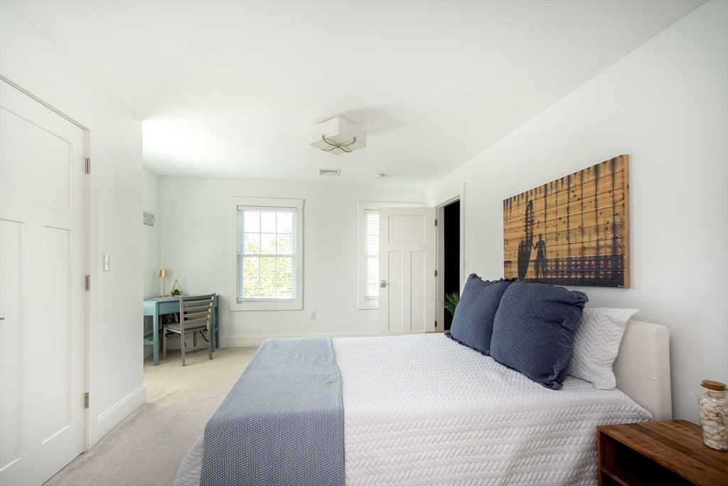 584 Hatherly Road Scituate, MA 02066 - Photo 20 of 42 a bedroom with a bed and furniture