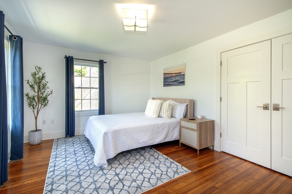 584 Hatherly Road Scituate, MA 02066 - Photo 25 of 42 a room with a bed and a window