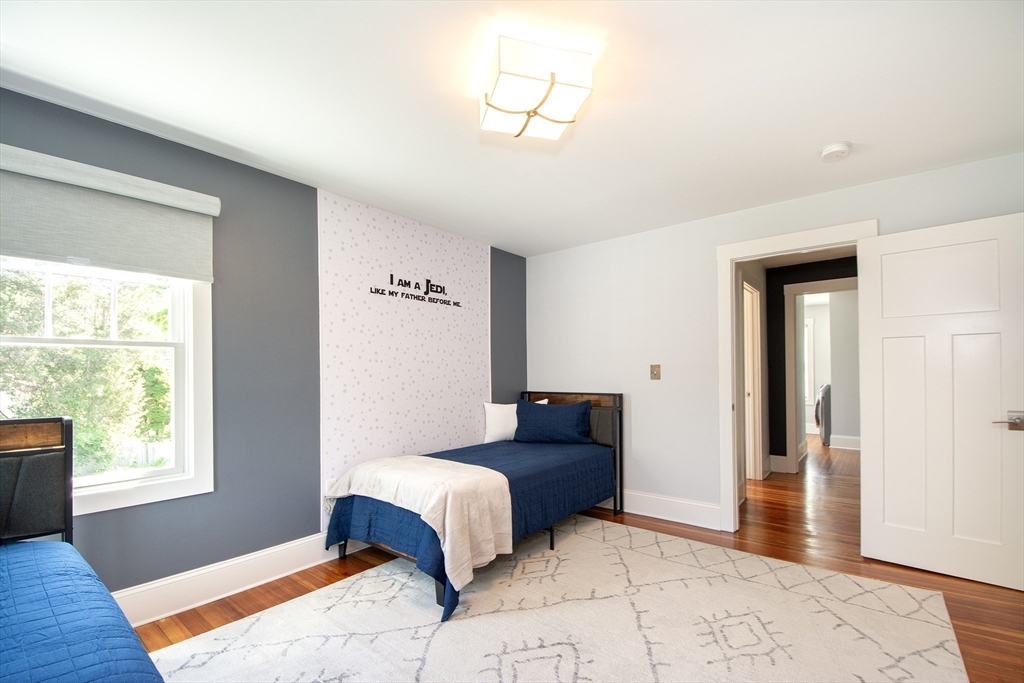 584 Hatherly Road Scituate, MA 02066 - Photo 26 of 42 a bedroom with a bed and a window