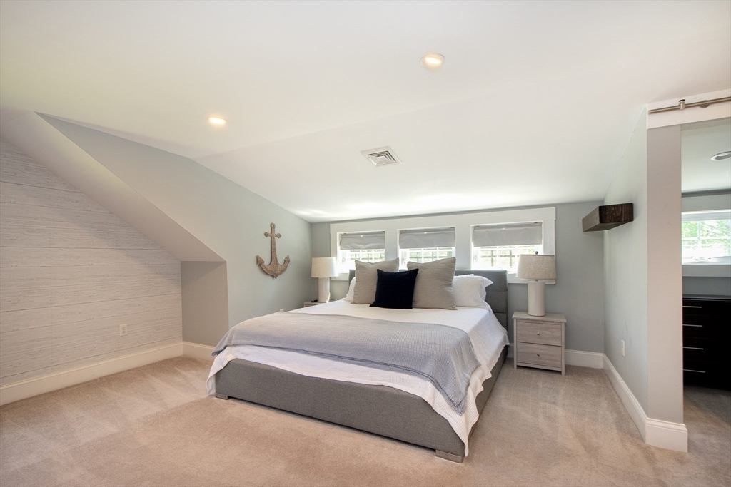 584 Hatherly Road Scituate, MA 02066 - Photo 29 of 42 a bedroom with a large bed and white walls
