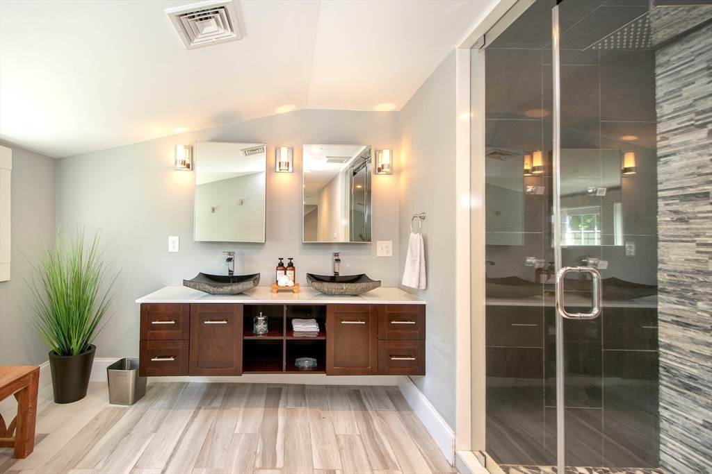 584 Hatherly Road Scituate, MA 02066 - Photo 32 of 42 a kitchen with stainless steel appliances a sink and cabinets