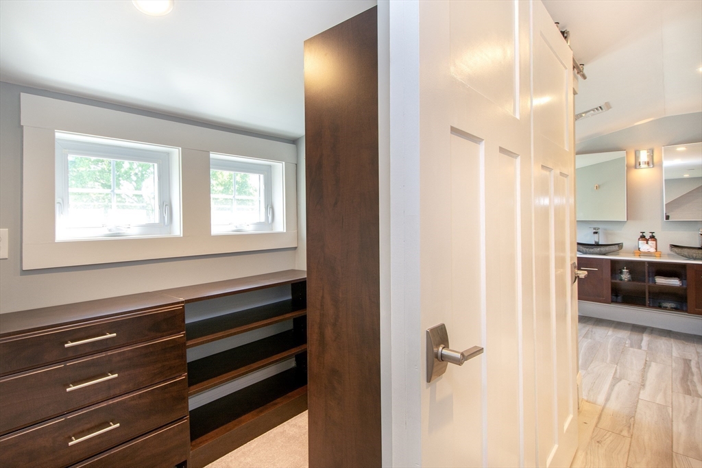 584 Hatherly Road Scituate, MA 02066 - Photo 33 of 42 a en suite bathroom with a sink and a mirror