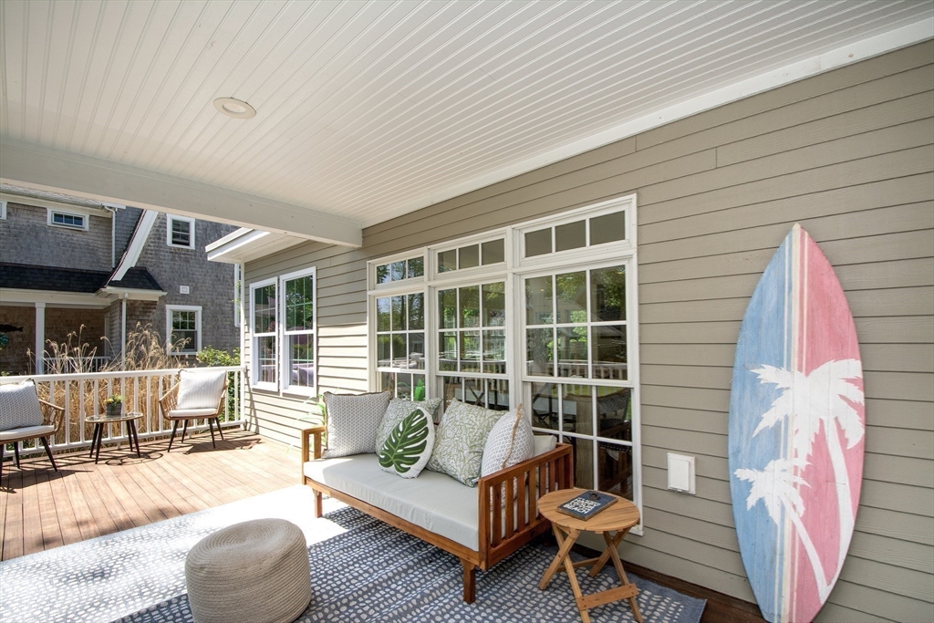 584 Hatherly Road Scituate, MA 02066 - Photo 36 of 42 a balcony with table and chairs