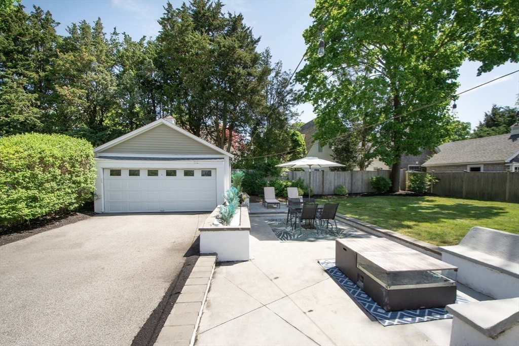 584 Hatherly Road Scituate, MA 02066 - Photo 38 of 42 a front view of a house with garden