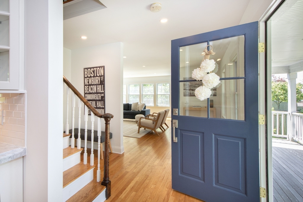 584 Hatherly Road Scituate, MA 02066 - Photo 7 of 42 a view of living room with wooden floor and windows