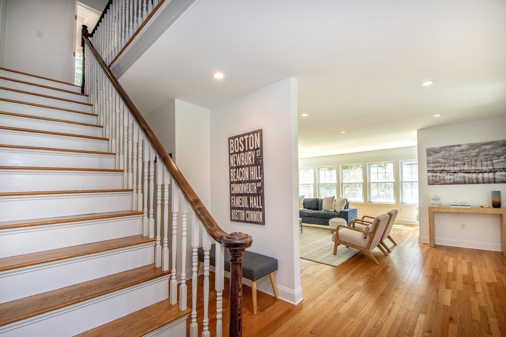 584 Hatherly Road Scituate, MA 02066 - Photo 8 of 42 a living room with furniture and a wooden floor