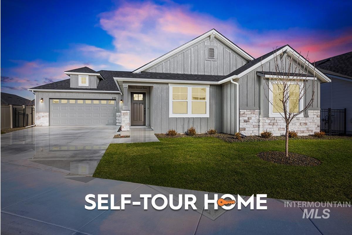 View of front of house featuring stone siding, board and batten siding, and a shingled roof