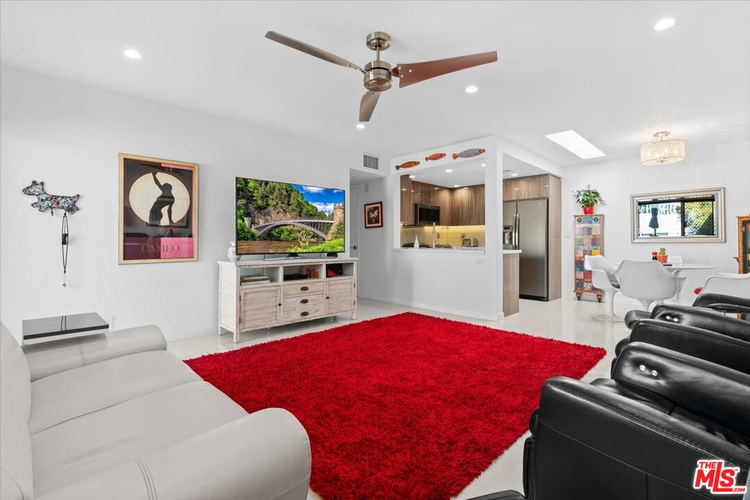 1111 East Ramon Road, Unit 17 Palm Springs, CA 92264 - Photo 1 of 34 a living room with furniture and a flat screen tv