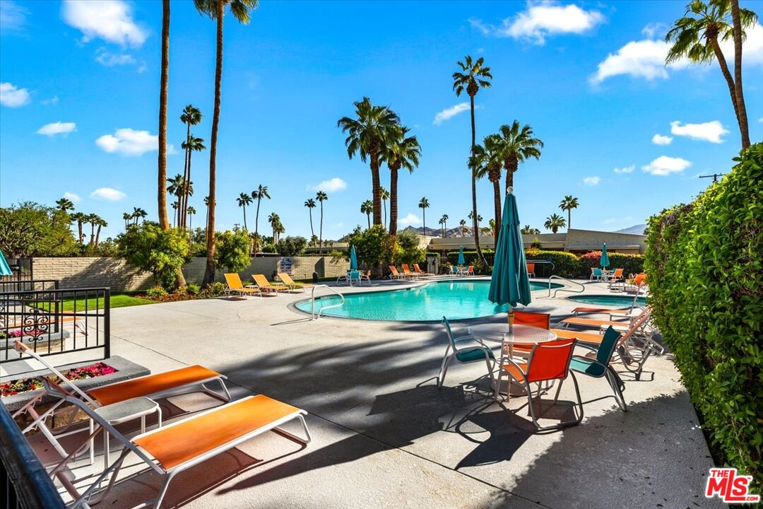 1111 East Ramon Road, Unit 17 Palm Springs, CA 92264 - Photo 27 of 34 a view of a backyard with sitting area