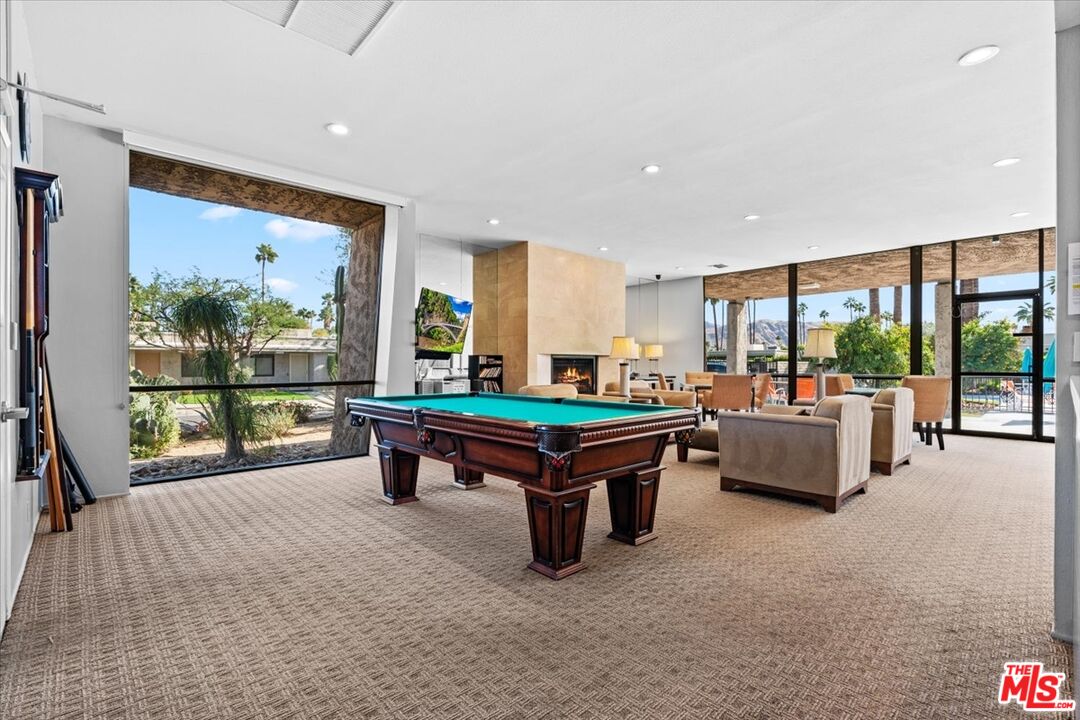 1111 East Ramon Road, Unit 17 Palm Springs, CA 92264 - Photo 28 of 34 a room with pool table and windows