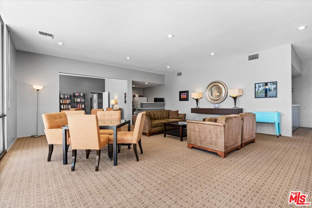 1111 East Ramon Road, Unit 17 Palm Springs, CA 92264 - Photo 31 of 34 a living room with furniture and a wooden floor