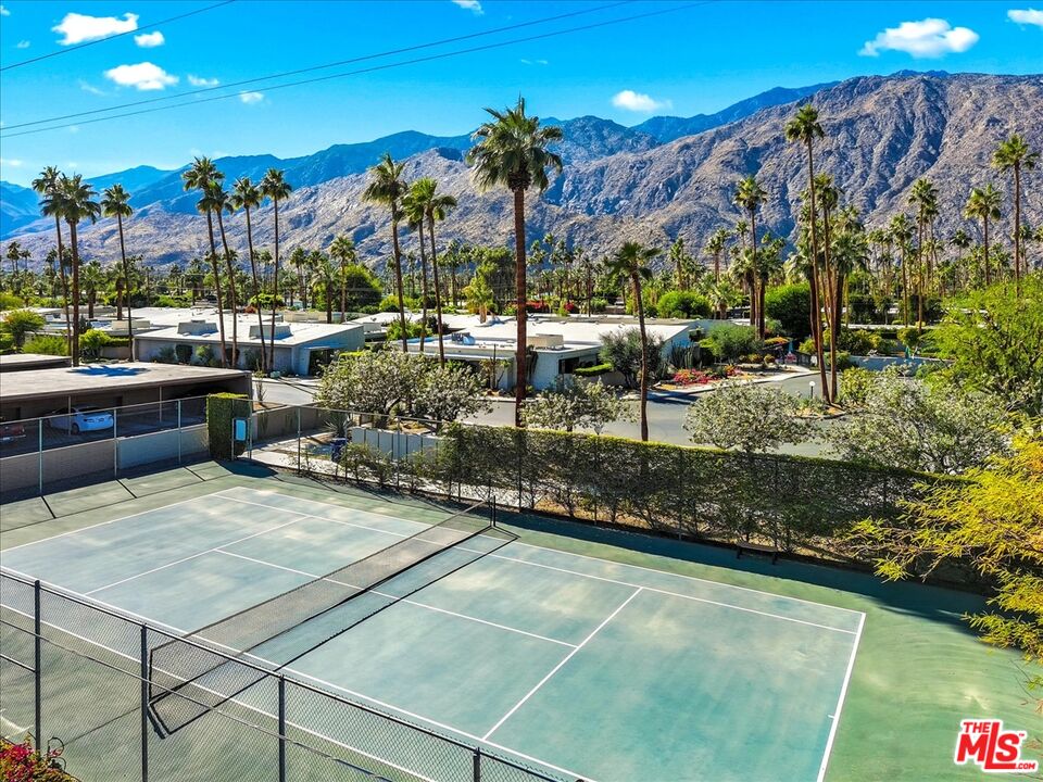 1111 East Ramon Road, Unit 17 Palm Springs, CA 92264 - Photo 33 of 34 a view of a patio with a table and chairs
