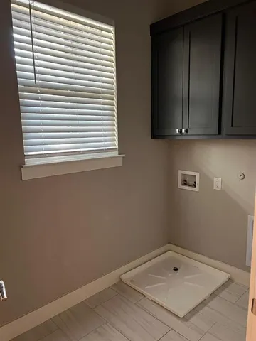 a bathroom with a sink and a window