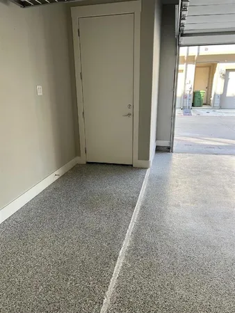 a view of a room with wooden floor and a window