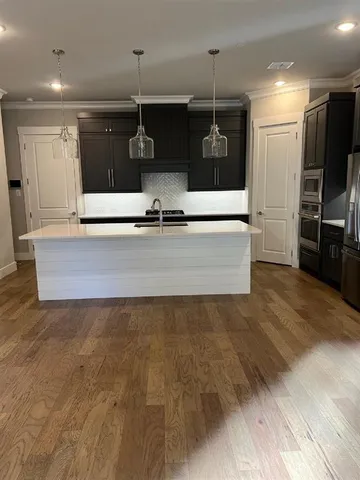 a view of a living room with a flat screen tv