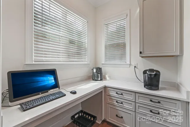 a kitchen with a window a sink and a counter top space